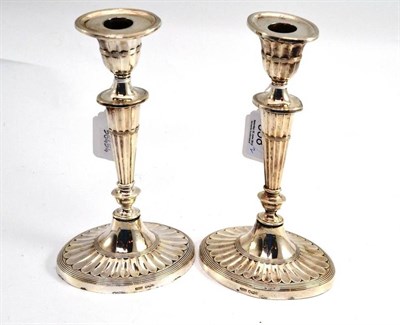 Lot 358 - A pair of silver loaded candlesticks, height 22cm