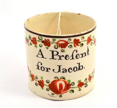 Lot 372 - A Leeds creamware Christening mug, 'A present for Jacob'