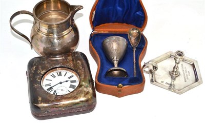 Lot 380 - A nickel cased Goliath pocket watch in a silver mounted travelling case, a silver jug, a silver...