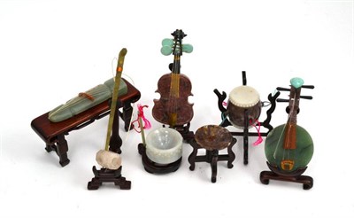 Lot 390 - Box of Oriental hardstone carvings of musical instruments