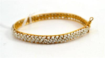 Lot 397 - An Indian seed pearl bangle