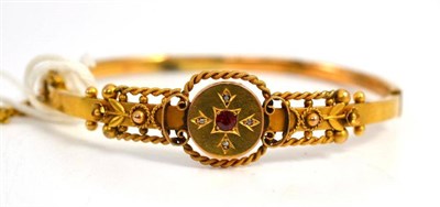 Lot 413 - A 9ct gold stone set bangle, hallmarked Chester 1918