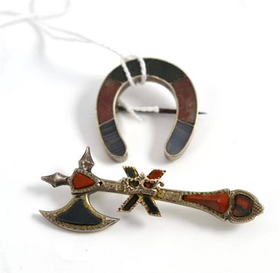 Lot 414 - A horseshoe brooch set with agates and an axe brooch