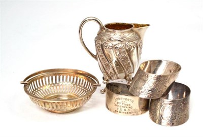 Lot 428 - Three silver engraved napkin rings; silver basket, Sheffield Assay 1928; Victorian silver cream jug