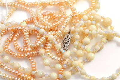 Lot 435 - Double strand Baroque pearls and a strand of opal beads