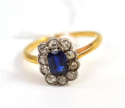 Lot 451 - A sapphire simulant and diamond cluster ring