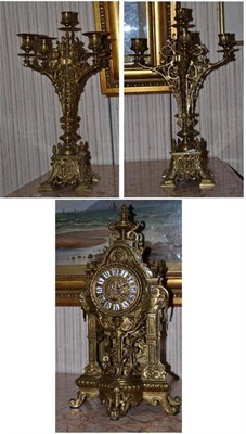 Lot 462 - A brass mantel clock of recent date, height 49cm and a pair of late Victorian brass four branch...