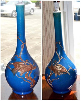 Lot 464 - Pair of blue glazed pottery lamps - repaired neck, height 48cm