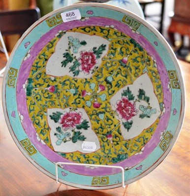 Lot 468 - A late 19th century Chinese famille rose dish decorated with peony on a puce and turquoise...