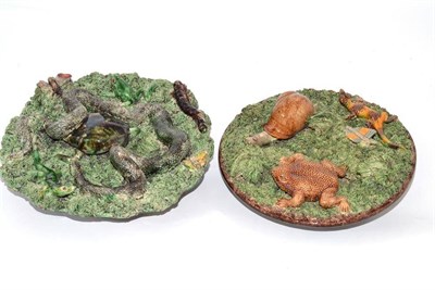 Lot 490 - Two Caldas plaques, each encrusted with snakes, frogs, lizards and snails on a mossy ground,...