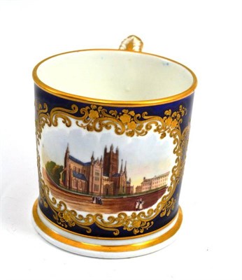 Lot 497 - A Chamberlain's Worcester mug, painted with a view of Worcester Cathedral within a gilt scroll...