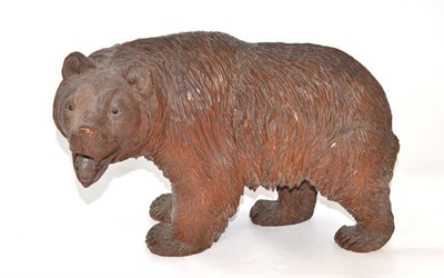 Lot 539 - A Black Forest carved wooden bear, 38cm