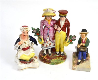 Lot 548 - A Staffordshire group 'The Dandies', a figure of a Turk and a figure of a boy with rat