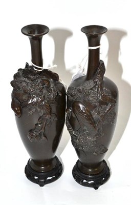 Lot 558 - Pair of late 19th/early 20th century Japanese bronze vases, cast with birds, 21cm high