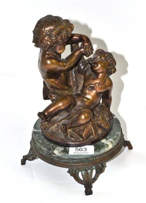 Lot 563 - Bronze figural group on a green marble base, 26cm high