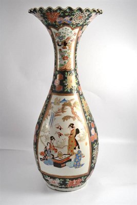 Lot 567 - A Japanese porcelain vase, decorated with panels of figures, height 70cm