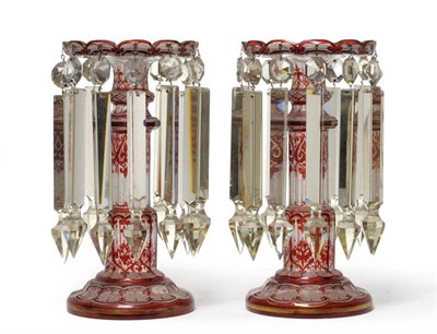 Lot 574 - A pair of ruby overlay clear glass lustres, circa 1860, the shallow dished tops with arcaded...