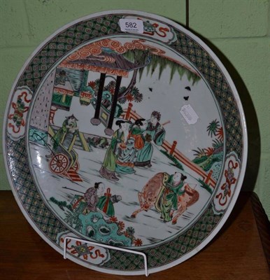 Lot 582 - A late 19th century Chinese famille verte charger in Xangxi style with dignitaries on a terrace...