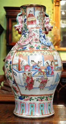 Lot 597 - A late 19th century Chinese famille rose vase with Buddhist lion handle applied with Chilong,...