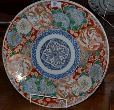 Lot 599 - A late 19th century Japanese Imari dish decorated with a border incorporating ho'o birds and...