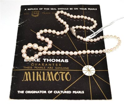 Lot 635 - A strand of Mikimoto pearls with sales document