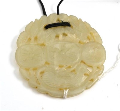 Lot 649 - A Chinese pale green jade pendant