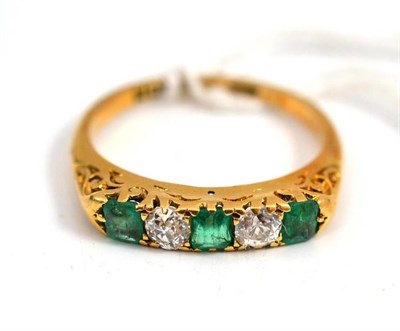 Lot 656 - A five stone emerald and diamond gold ring