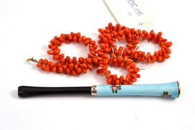 Lot 674 - A coral necklace and an enamelled cigarette holder