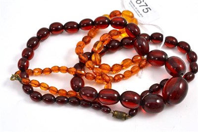 Lot 675 - A cherry amber bead necklace and a faceted bead necklace