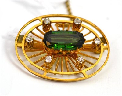 Lot 679 - A green tourmaline and diamond set brooch