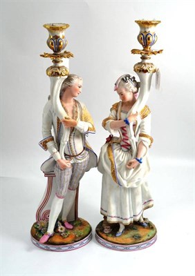 Lot 683 - Pair of French bisque candlestick figures, height 51cm