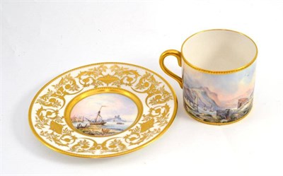 Lot 693 - A coffee can and saucer, by Stefan Nowacki, circa 1985, painted with boats on rivers before...