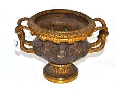 Lot 706 - After the Antique: a parcel gilt two-handled campana vase, 19th century, with interlaced reeded...