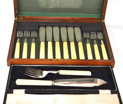 Lot 716 - A cased pair of silver fish servers and a cased set of six fish knives and forks