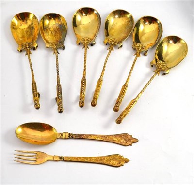 Lot 732 - A set of six Continental gilt metal spoons with figural terminals, twist stems and fig shaped...