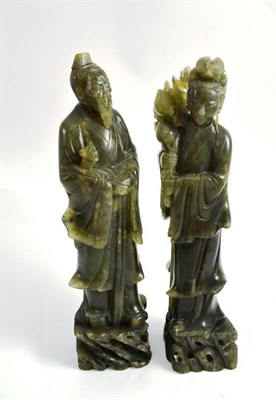 Lot 754 - Pair of late 19th/early 20th century jade type oriental figures, 29cm high