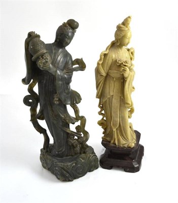 Lot 755 - Two Chinese carved soapstone figures, 30cm high