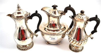 Lot 756 - Silver coffee pot London, assay, 1892; two silver hot water jugs