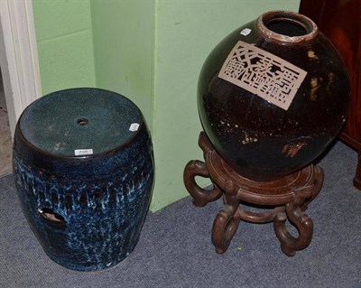 Lot 758 - A large Japanese brown glazed storage jar, with wax resist large square seal and mon, 43cm high, on