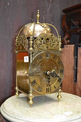 Lot 769 - An early 20th century lantern form timepiece with passing strike