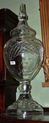 Lot 786 - A large glass vase and cover, mid 19th century, the panelled domed cover with similar knop, the...