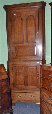 Lot 796 - A George III oak floor standing corner cupboard, height 239cm