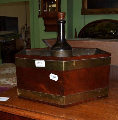 Lot 811 - A mahogany and brass bound hexagonal shaped bottle carrier with lead lined interior