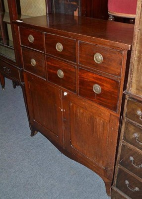 Lot 816 - A late Georgian mahogany chest of drawers with cupboard to base