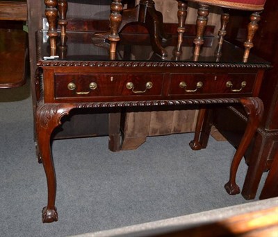 Lot 825 - An Edwardian mahogany two drawer serving table