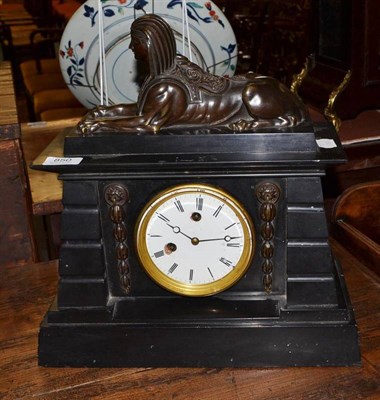 Lot 850 - An Egyptian revival black slate mantel clock with pendulum, height 40cm