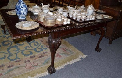 Lot 852 - An early 20th century mahogany extending dining table on claw and ball feet, 218cm extended