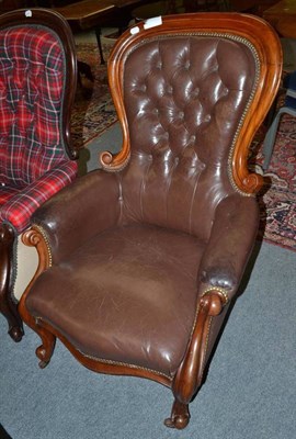 Lot 857 - A Victorian mahogany framed armchair upholstered in brown button leather