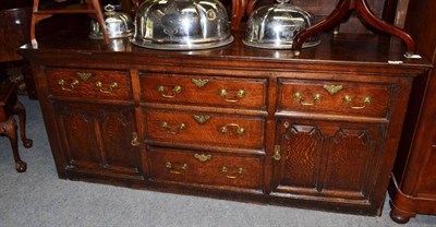 Lot 892 - A 18th century oak dresser base with five drawers and cupboard doors, width 192cm