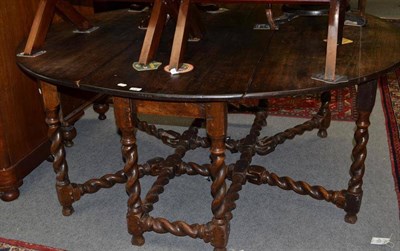 Lot 896 - A 17th century drop leaf table, width 157cm